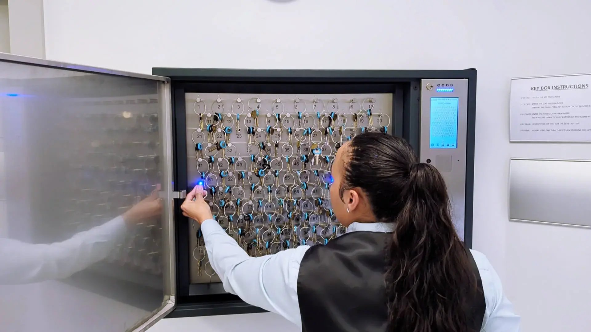 ecos_key_management_staff_using_key_cab_at_corniche_condo_US